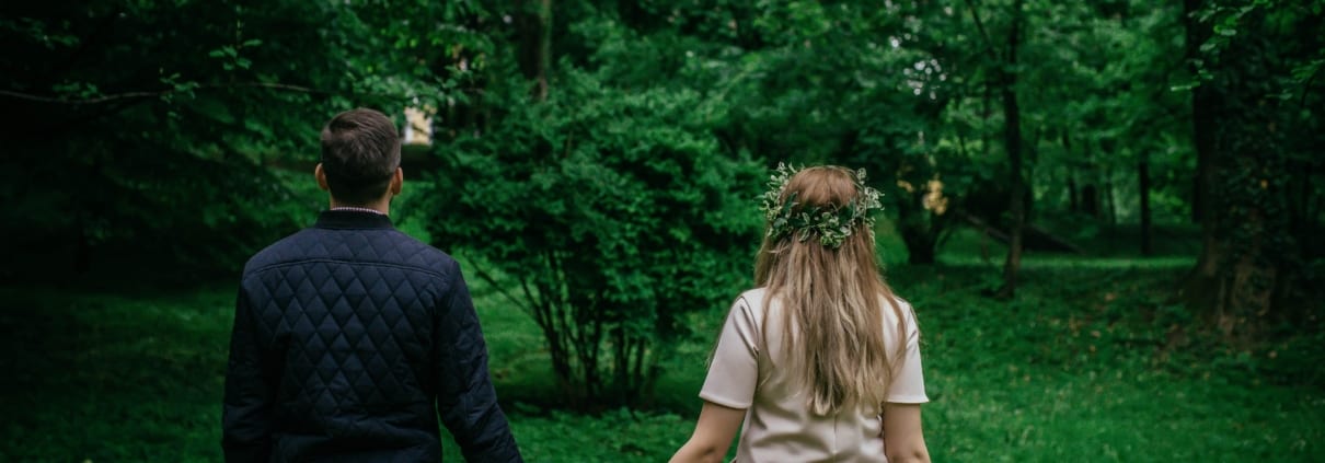 couple-walking-in-woods