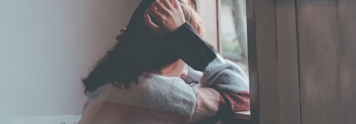 sad-woman-at-window