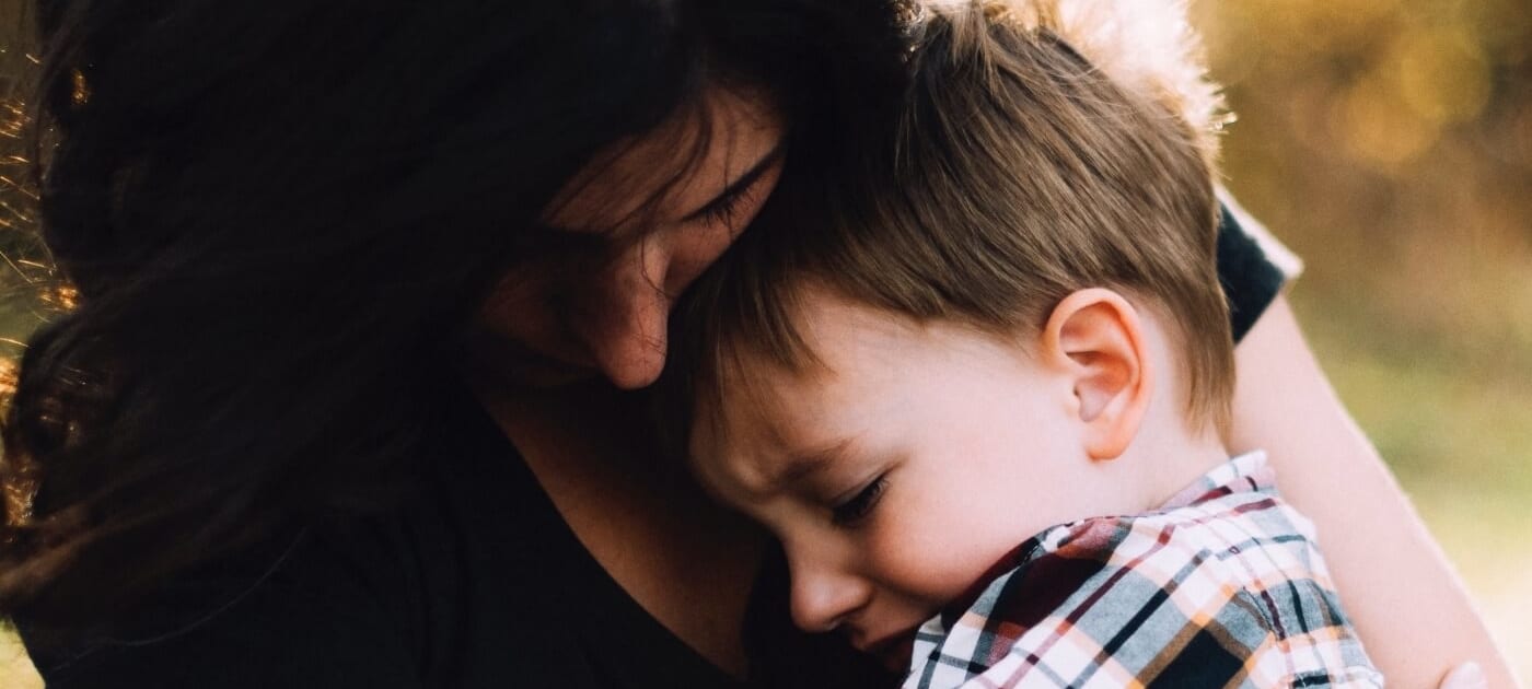 mom comforting child with storm anxiety
