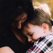 mom comforting child with storm anxiety