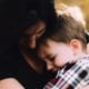 mom comforting child with storm anxiety