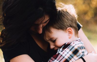 mom comforting child with storm anxiety