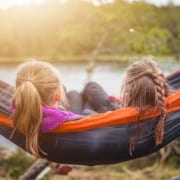 kids enjoying quiet time in hammock