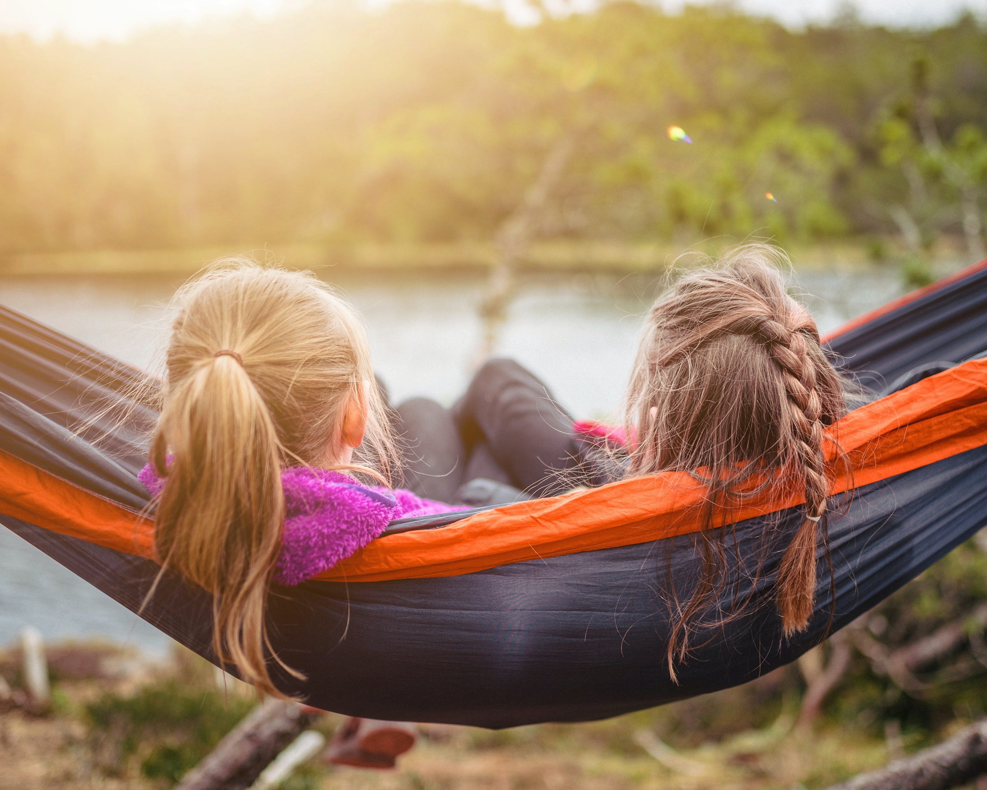 kids enjoying quiet time in hammock