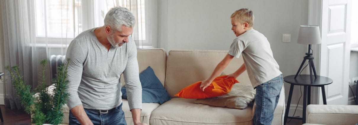 father and son cleaning house