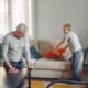 father and son cleaning house