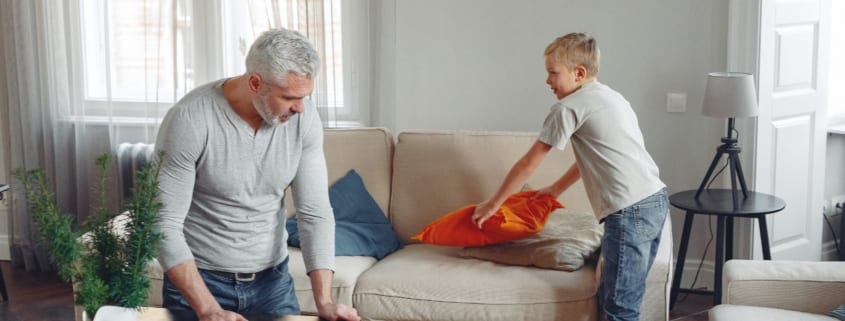 father and son cleaning house