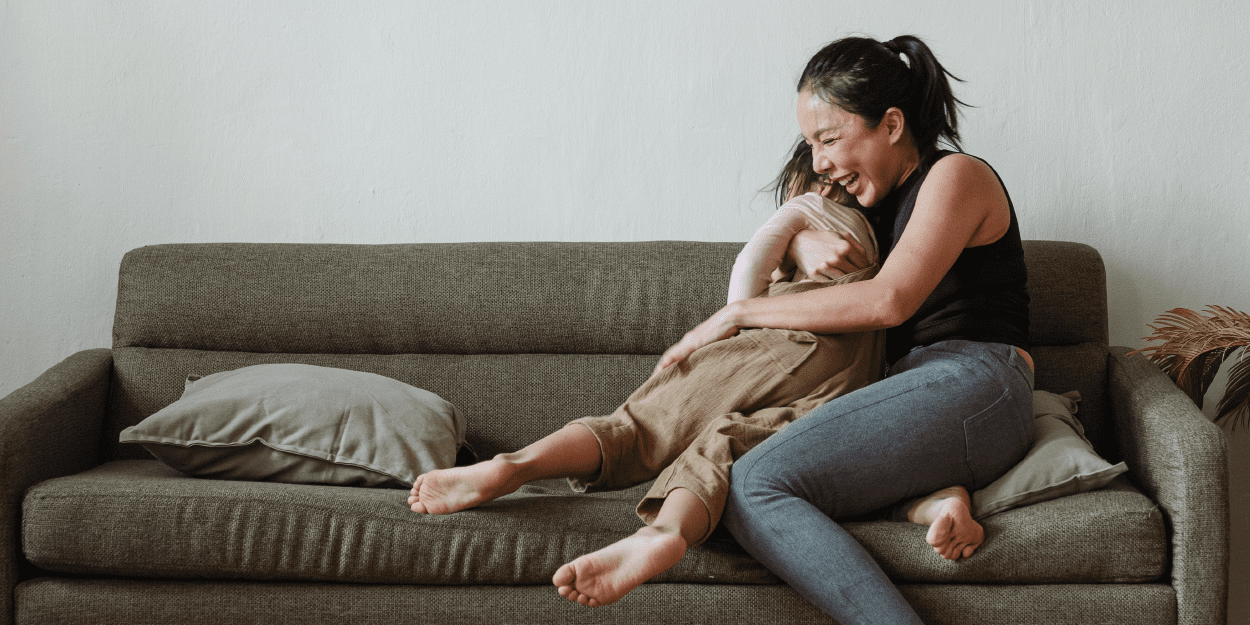 woman hugging her daughter