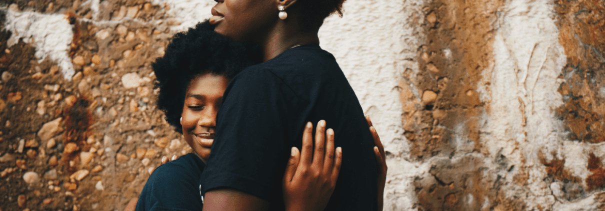 Hugging mother and daughter