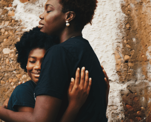 Hugging mother and daughter
