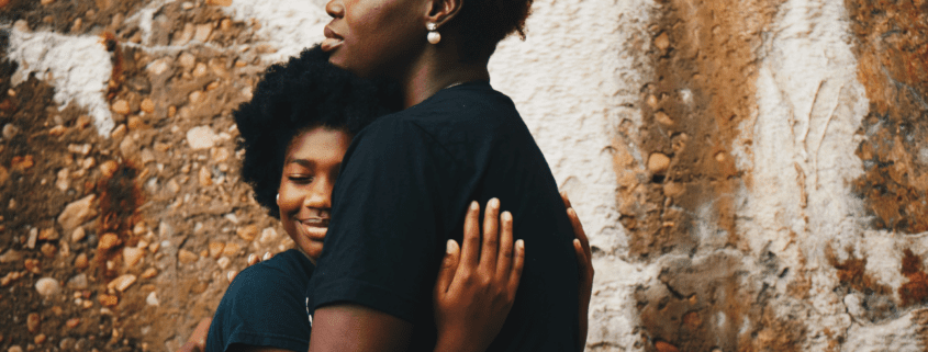 Hugging mother and daughter