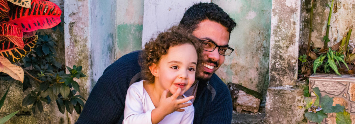 dad and daughter smiling