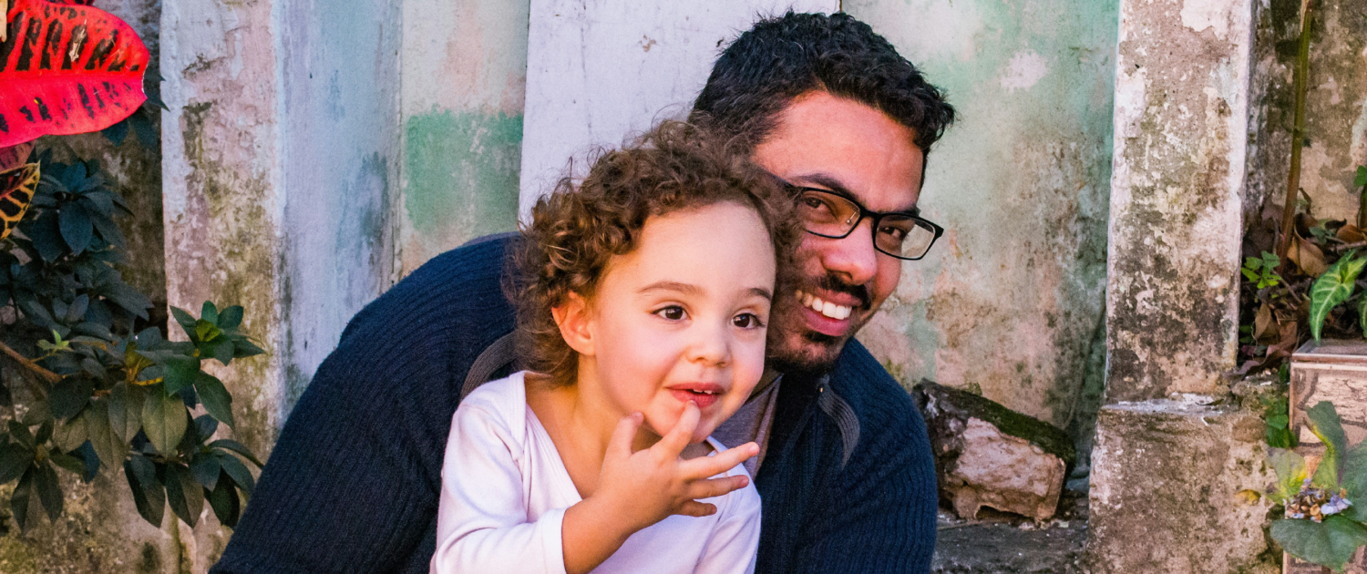 dad and daughter smiling
