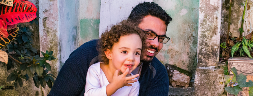 dad and daughter smiling